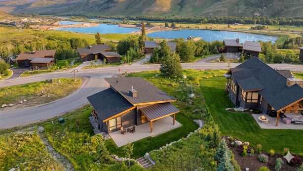A residential area with houses, a road, and a lake. - Summit County Gem |  Designer Kitchen + Great Views (Silverthorne)