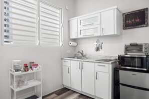 Apartamento, terraço | Cozinha privada