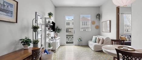 Deluxe House | Living area | 32-inch flat-screen TV with cable channels