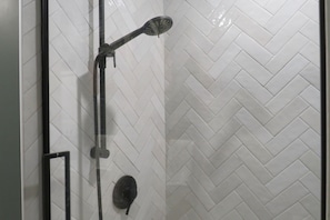 Shower, hair dryer, towels, toilet paper