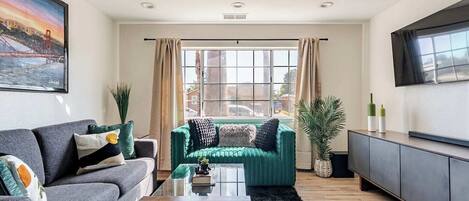Smart TV, fireplace, books, computer monitors