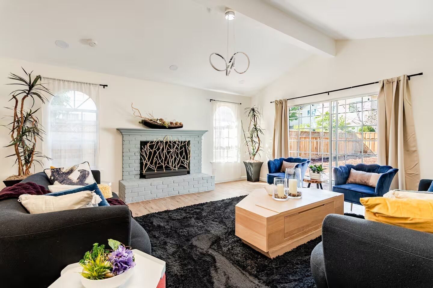 Smart TV, fireplace, books, computer monitors