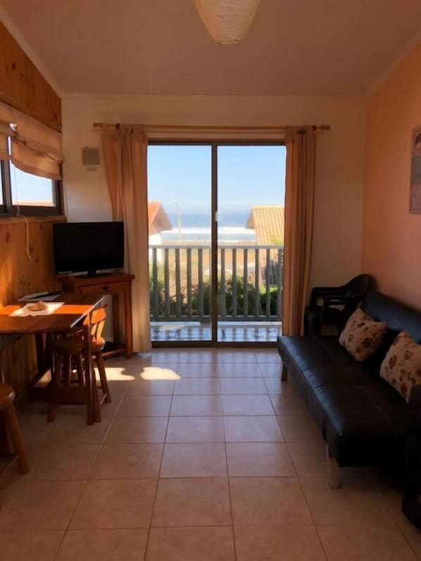 Standard Apartment, Balcony, Partial Sea View | Living area - Cabañas Piedra Grande (Pichilemu)