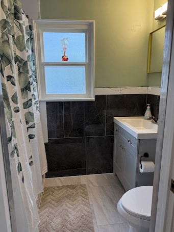 Hair dryer, towels, soap, toilet paper. Willow & Wildflower Retreat | Cozy, Unique, Family Stay