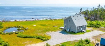 Cozy, tranquil waterfront retreat with a stunning oceanfront view in the pines.