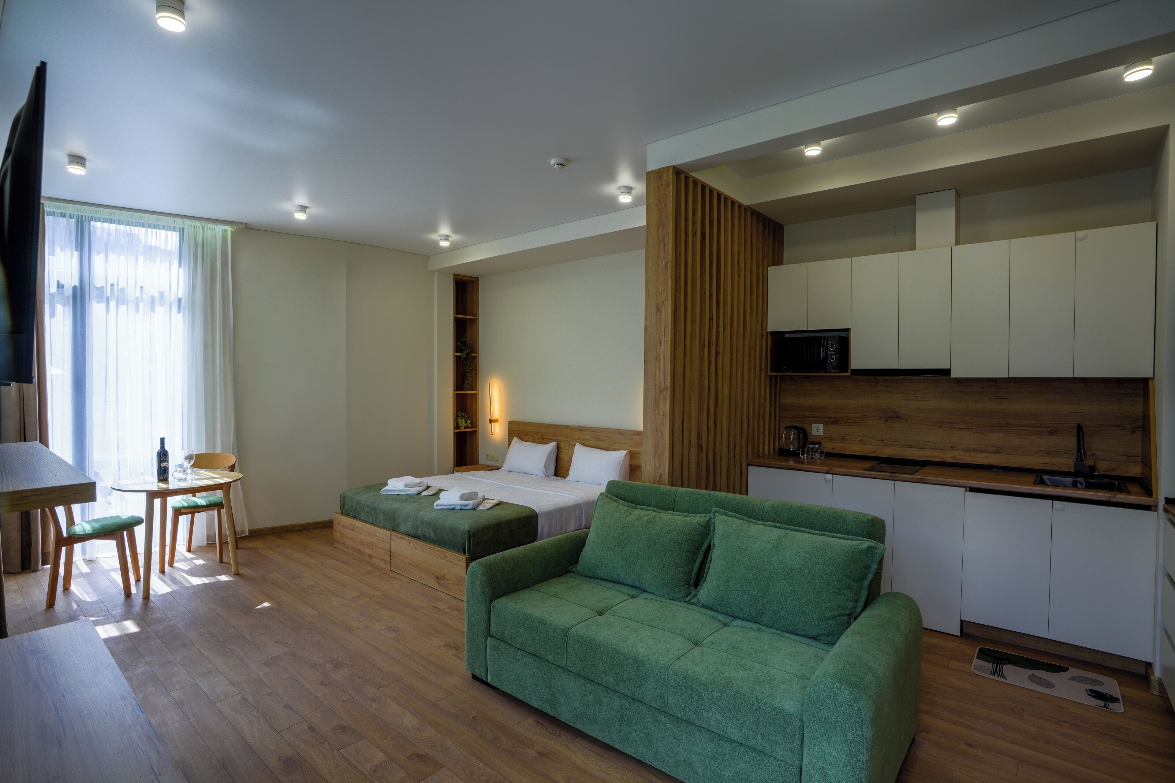 Studio – deluxe, balkong, fjellutsikt | Oppholdsområde
