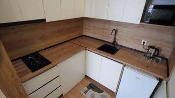 Luxury Apartment, 1 Bedroom, Partial Sea View | Private kitchen | Mini-fridge, microwave, stovetop, cookware/dishes/utensils