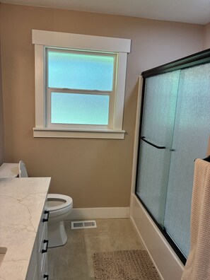 Shower, hair dryer, towels, soap