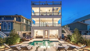A multi-story house with a swimming pool, outdoor seating, and a staircase leading to the upper floor. - Sugar Magnolia: Close to beach in Grayton w/ Pool!  4 Kings + 6 Bunks; sleeps 14 (Santa Rosa Beach)