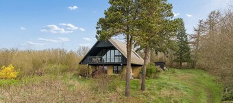 Holiday home in the forest with sea view