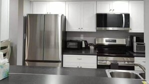 Fridge, microwave, oven, stovetop - Beach Club Corner Condo w/Pool - Steps to Beach (Ocean City)