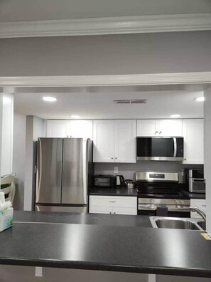 Fridge, microwave, oven, stovetop - Beach Club Corner Condo w/Pool - Steps to Beach (Ocean City)
