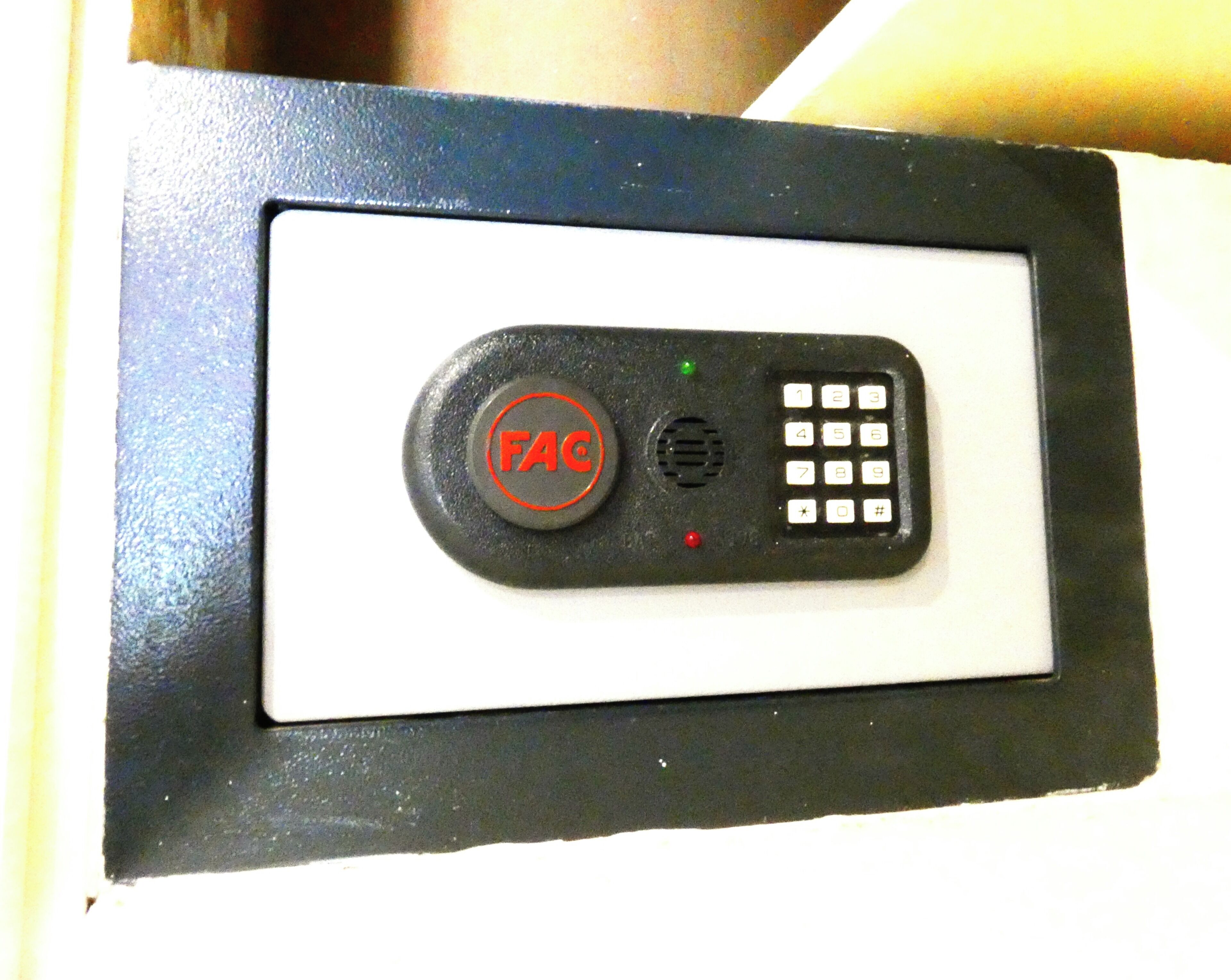 A control panel with a button labeled 'FAC' and a numeric keypad.
