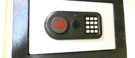 A control panel with a button labeled 'FAC' and a numeric keypad.