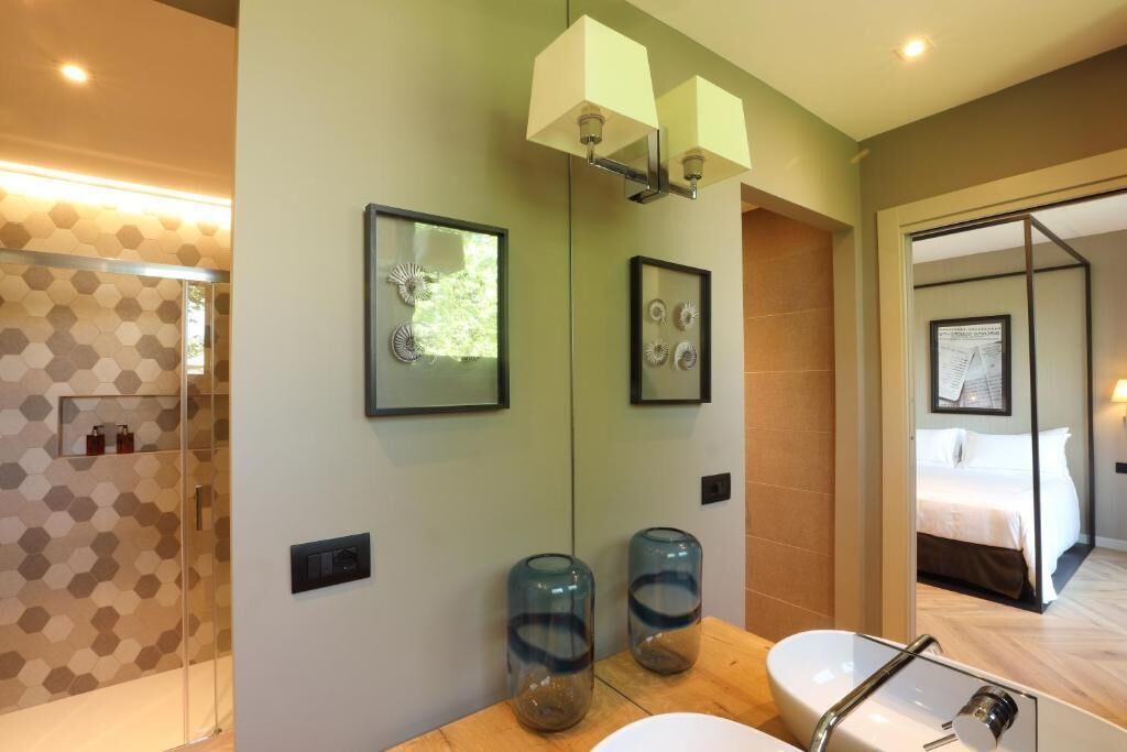 Apartment, Garden View | Bathroom | Slippers, towels, soap, shampoo