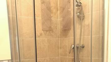 Shower, hair dryer, towels, soap