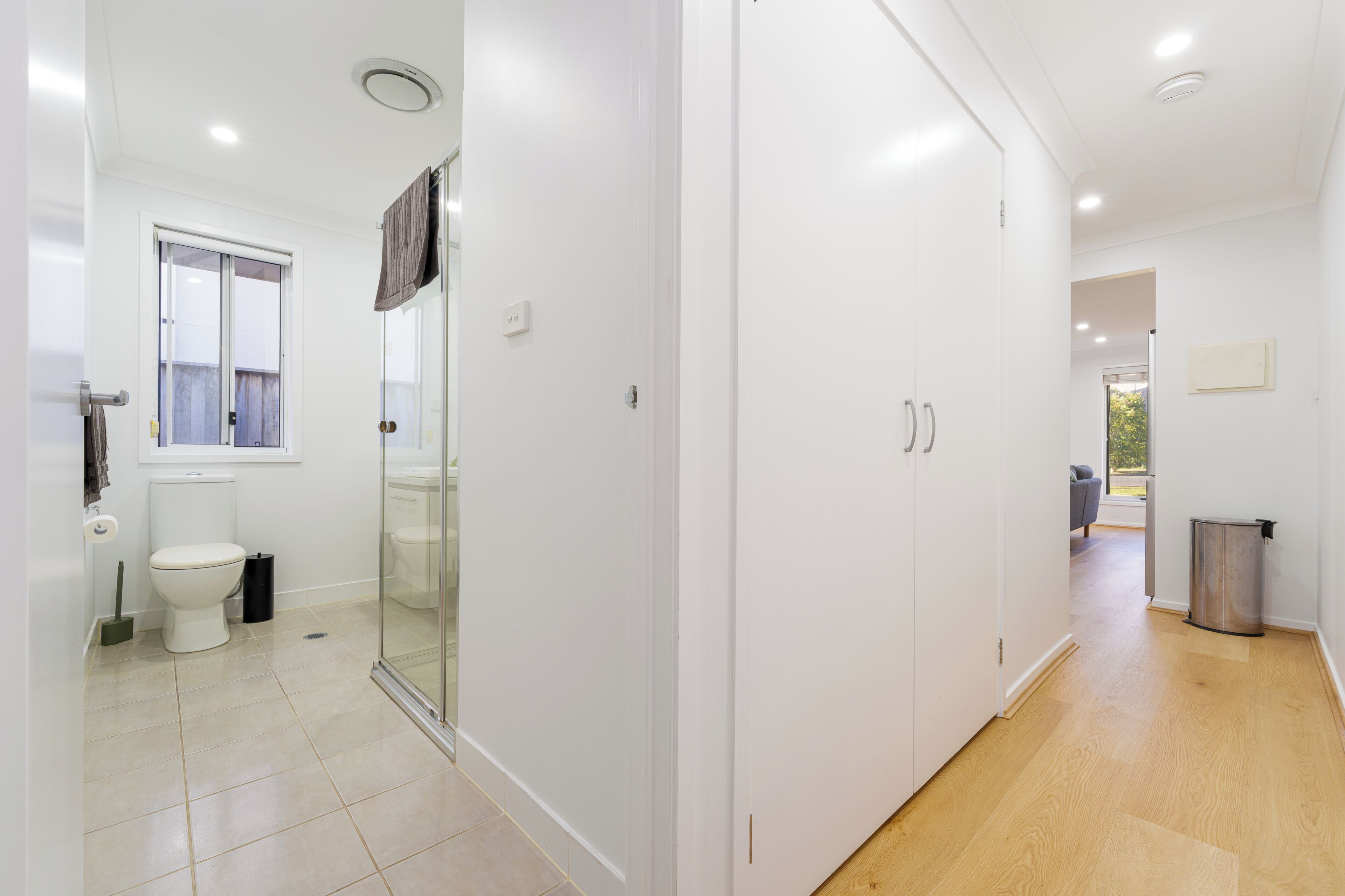 A modern bathroom with a toilet, bidet, and shower.