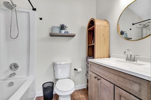 Shower, hair dryer, towels, toilet paper