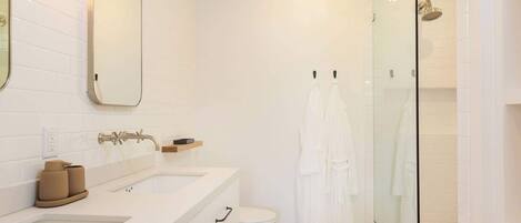 Shower, hair dryer, towels, shampoo