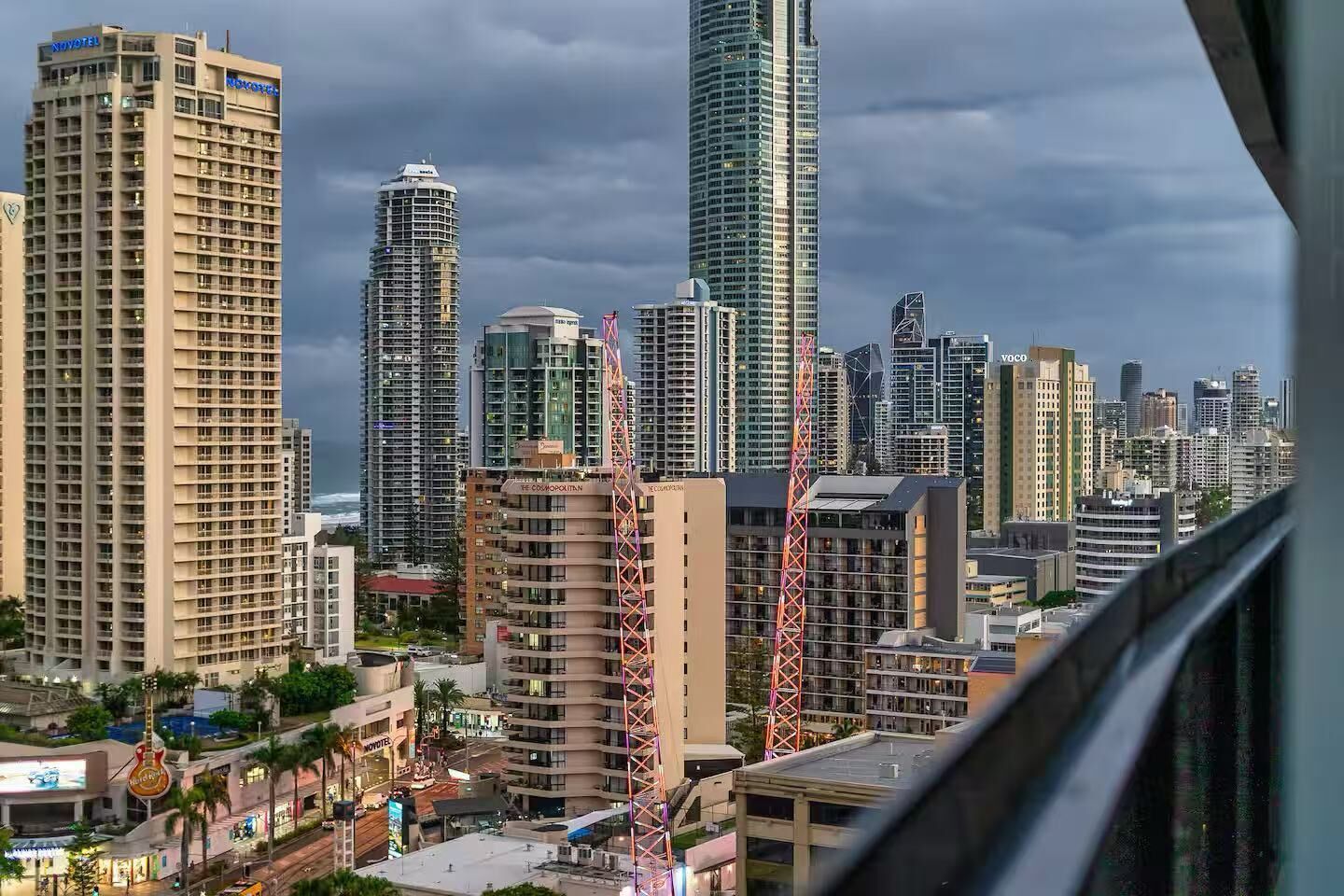 A cityscape with high-rise buildings, including a hotel with a visible sign.