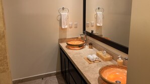 A bathroom with two sinks, a large mirror, and a towel rack. - One Bedroom Oceanfront - Puerto Escondido 1423 (Bajos de Chila)