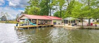 Waterfront, w/covered boat slip, screened gazebo, kayaks, slide w/swim area