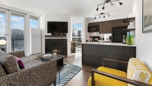 A modern apartment with a living room, kitchen, and dining area. - Vancouver | Urban Group Retreat | Walkable + Sauna | 2BR (Vancouver)