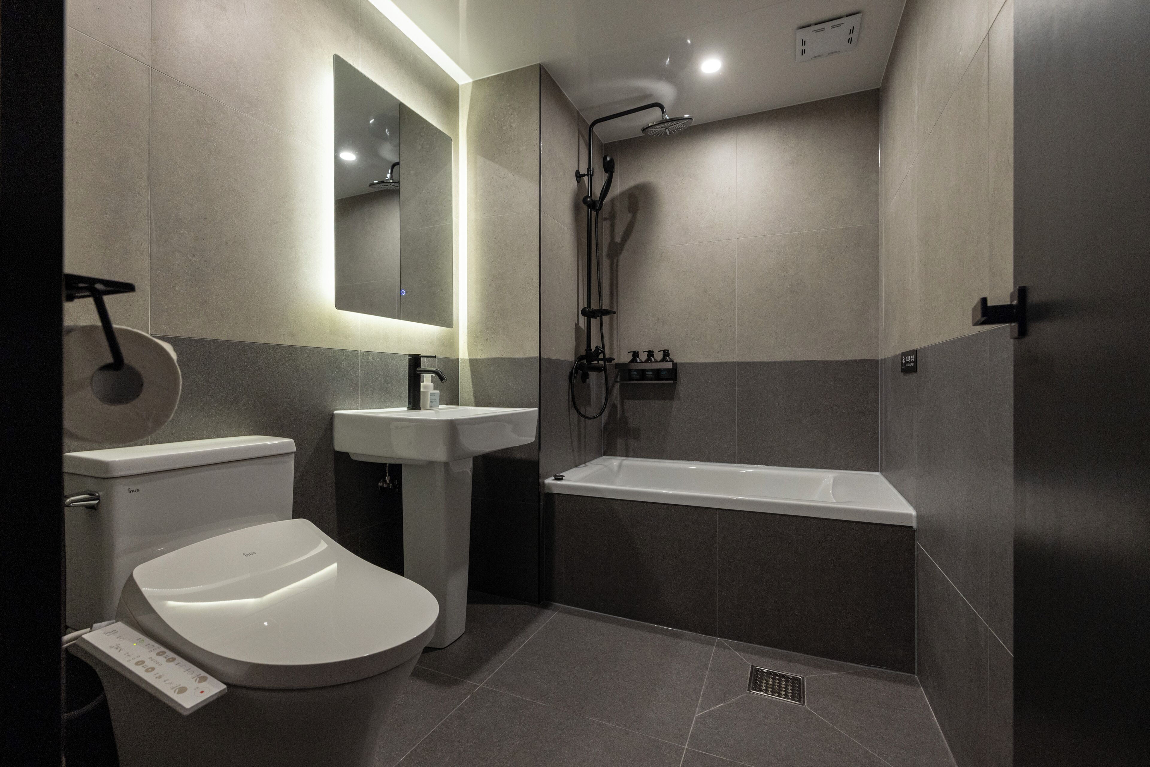 Separate bathtub and shower, hair dryer, slippers, towels