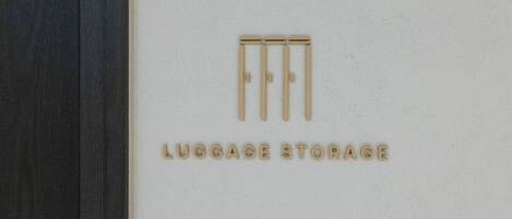 A logo with the text 'LUGGAGE STORAGE' on a white background.