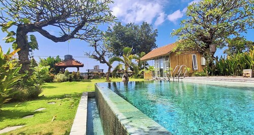 Rumah Putih – Great Value Beachfront 1BR with Pool & Garden