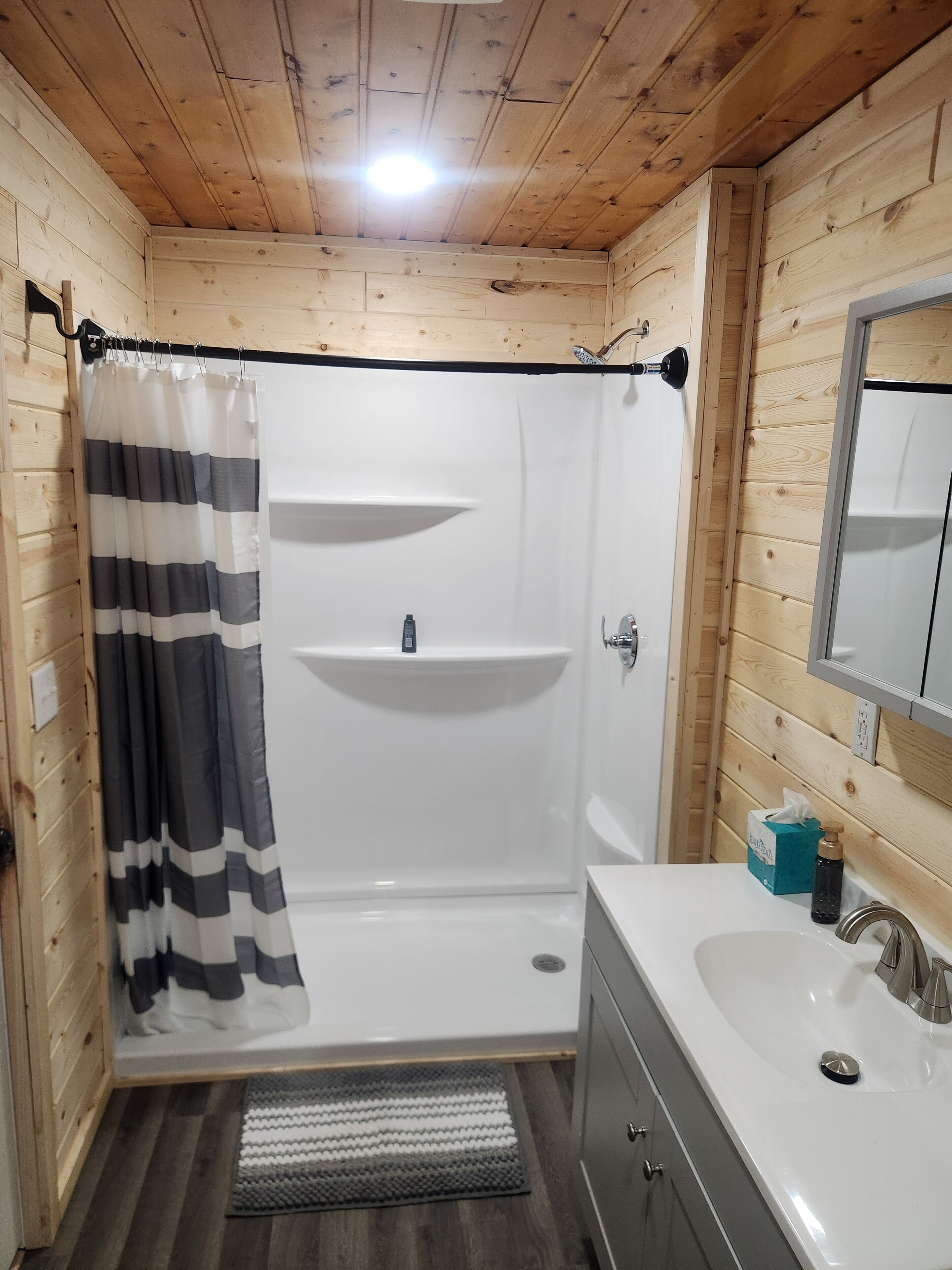 Shower, towels, soap, toilet paper
