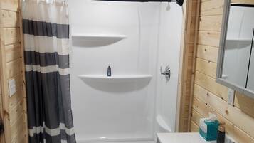 Shower, towels, soap, toilet paper