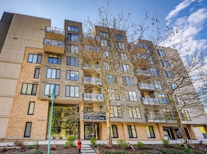 A multi-story building with a sign reading 'Legacy on Mara Lake.'