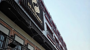 A multi-story building with a prominent sign reading 'DARAMA HOTEL.' - Peya Rama-7 (Bang Kruai)