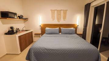 Apartment, 1 King Bed, Kitchen, Garden View | Free minibar, blackout curtains, iron/ironing board, free WiFi