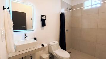 Apartment, 1 King Bed, Kitchen, Garden View | Bathroom | Shower, towels, soap, toilet paper