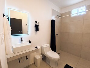 Apartment, 1 King Bed, Kitchen, Garden View | Bathroom | Shower, towels, soap, toilet paper - Tayga studios Cancun (Cancun)