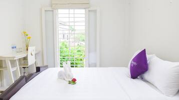 Comfort Room | Premium bedding, memory-foam beds, blackout curtains, iron/ironing board