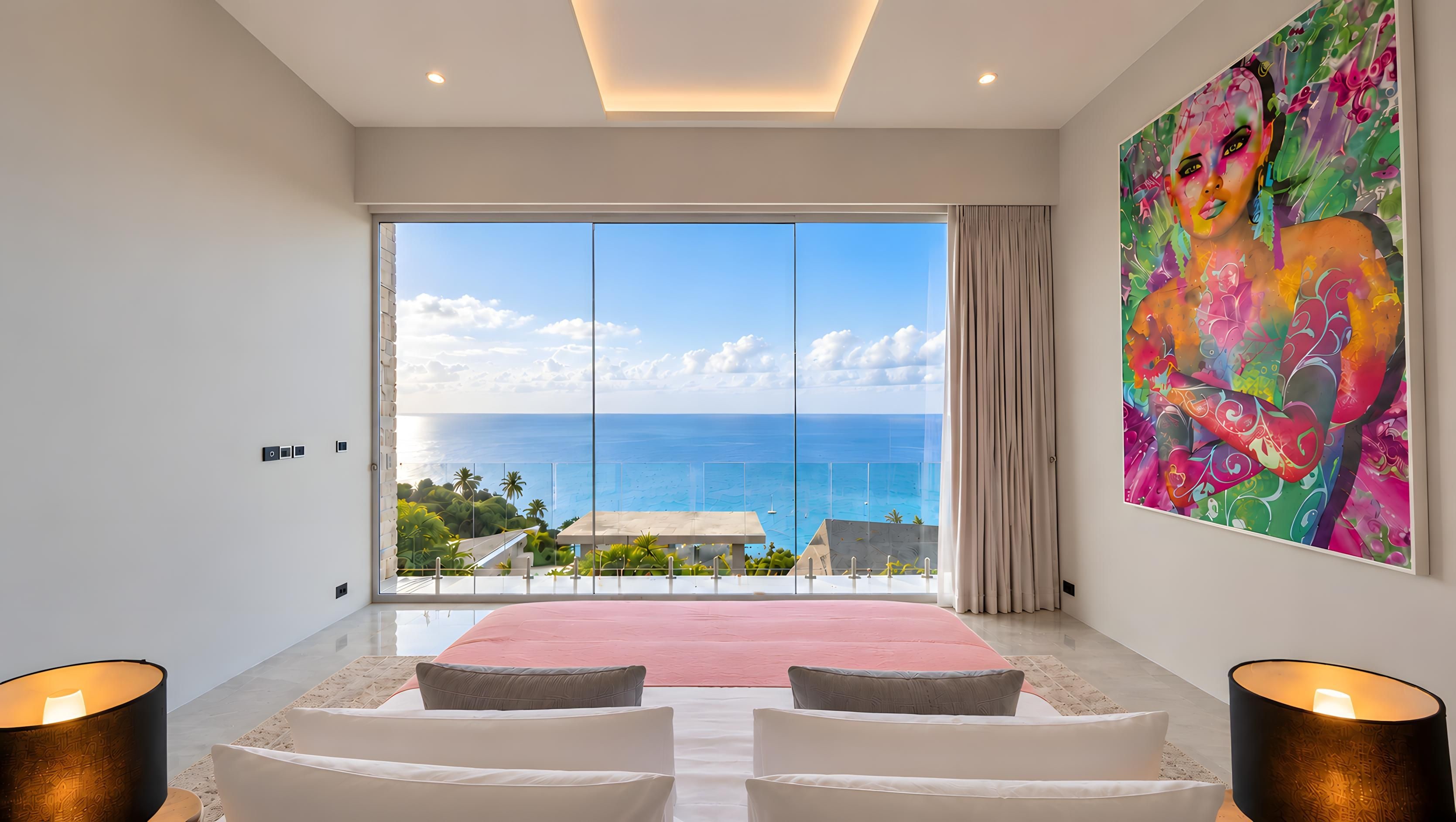 A bedroom with a large bed, two bedside lamps, a colorful abstract painting, and a view of the sea.