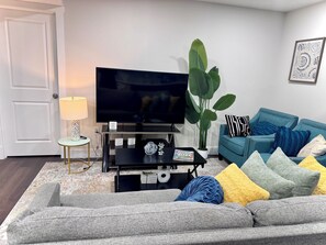 Living area - Cozy, modern space with dedicated workspace. Transit bus just opposite the road. (Calgary)