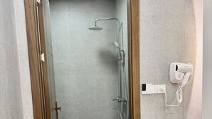 A bathroom with a shower, toilet, and sink. - Mimocha Hotel - Hoa Lu Ancient Town Ninh Binh (Hoa Lu)