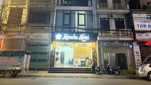 A multi-story building with a prominent 'Mimocha Hotel' sign. - Mimocha Hotel - Hoa Lu Ancient Town Ninh Binh (Hoa Lu)