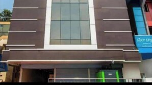 A modern building with a sign reading 'Rosee Wood.' - Rosee Wood (Visakhapatnam)