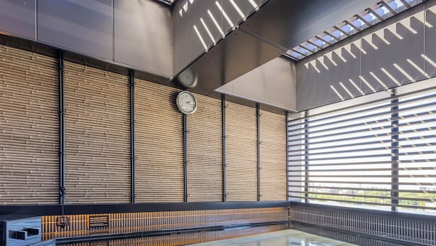 A modern indoor pool area with a glass floor, metal railings, and a clock on the wall. - APA Hotel Keisei Ueno Ekimae Minami (Tokyo)