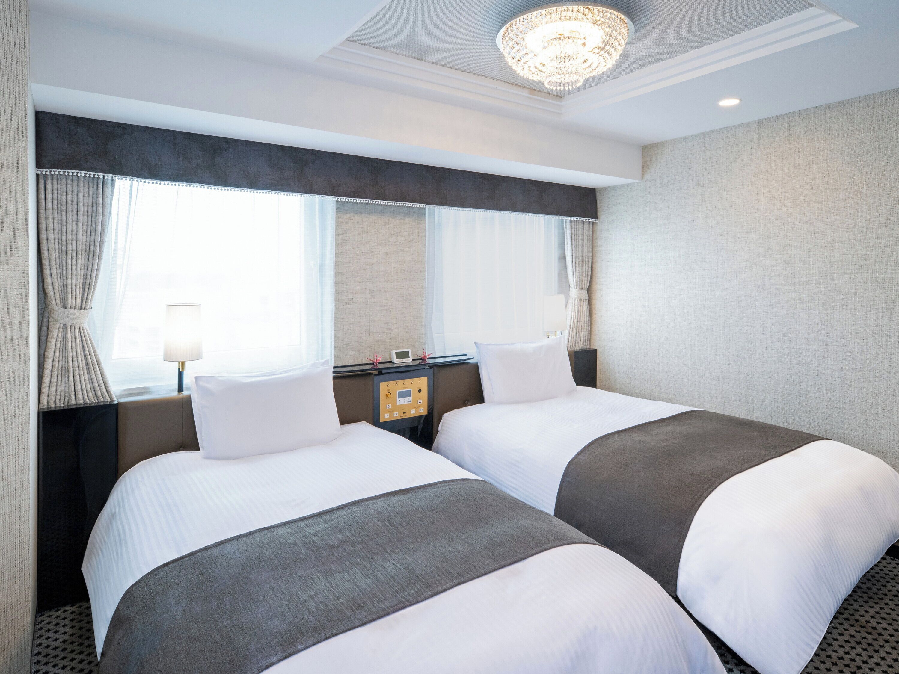 Deluxe Twin Room, Non Smoking | Down comforters, desk, laptop workspace, blackout drapes