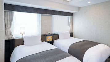 Deluxe Twin Room, Non Smoking | Down comforters, desk, laptop workspace, blackout drapes