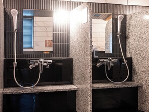 A bathroom with two sinks, each with a handheld showerhead, and a mirror above. - APA Hotel Keisei Ueno Ekimae Minami (Tokyo)