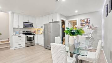 Coffee/tea maker, fridge, microwave, oven