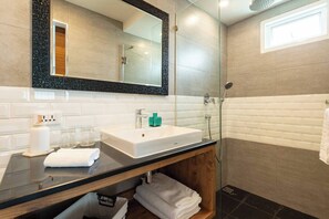 Shower, hair dryer, towels - Dual-view luxury corner retreat, artisan touches (Bangkok)