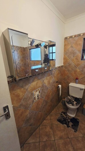 Bathroom - Serene 1-Bedroom Apartment with Garden & Shared Pool (Roodepoort)